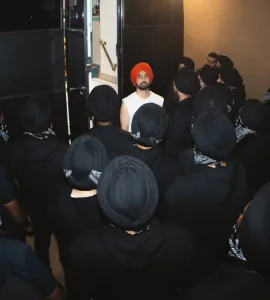 A group of bodyguard surrounding singer diljit dosanjh singer